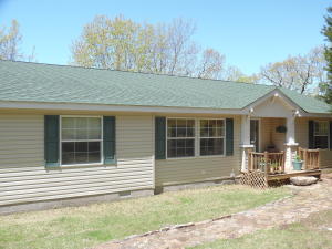 Very nice, well maintained, pretty double wide on 4+ acres and a lake view. Private setting. Only l.5 miles to the Hwy. 125 recreation area, resort, and marina on Lake Bull Shoals.  Perfect lake home.