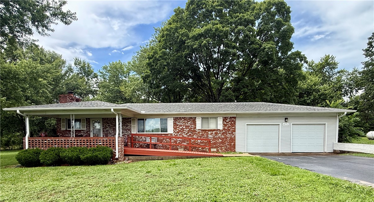 Opportunity awaits with this charming 3-bedroom, 2-bath home situated on a beautiful 1.93-acre lot in a desirable Gateway area . Nestled back from Highway 37, this property offers  combination  of space, and potential.
Inside, you’ll find a spacious living area, kitchen, and a lutility room providing excellent functionality. Wood flooring throughout most of the home, carpet in the bedrooms and linoleum flooring in the wet areas.
Outside, features two storage buildings, a detached garage, and a privacy-fenced area just off the back door—ideal for pets, entertaining, or relaxing outdoors. A previous mobile home site on the north side of the property still has existing water, electric, and septic connections, offering possibilities for future use.
Whether you’re looking for a peaceful country setting, room to expand, or a property you can customize into your dream home, this acreage offers endless potential. Enjoy the privacy, mature surroundings, and convenient location while making this property your own.