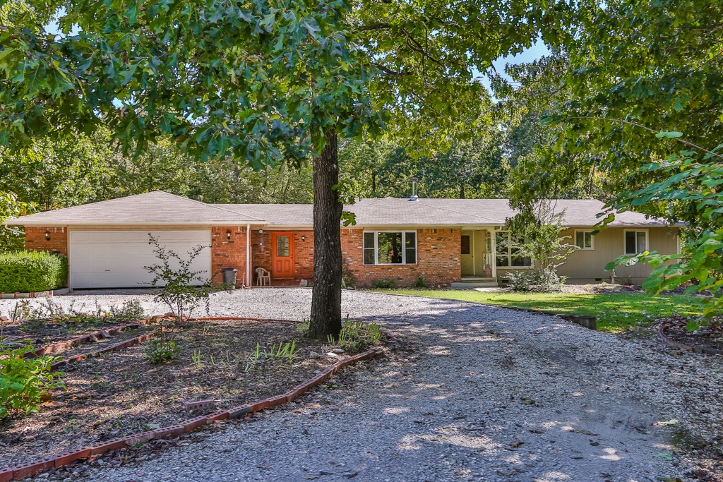 You'll love the peace and quiet in this beautiful home on a wooded 2.2 acres. Enjoy warm and cozy nights in spacious living areas next to the wood burning stove. Take in the beauty of your surroundings through large windows. All the natural light makes you feel as if outside is coming in! Enjoy bright and blissful afternoons on the deck, imagine the smell of the grill with a cold drink in hand. With so much space there's room for endless outdoor actives.Perfect place for those who want to get out of town!