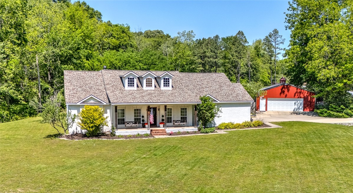 Spacious, thoughtfully updated home on 1.31 acres in a central NWA location. This 6-bedroom, 4- bathroom home offers a flexible layout designed for everyday living and entertaining. The expansive primary suite features dual closets, while additional highlights include a bonus room upstairs, large laundry and mudroom, and a walk-in butler’s pantry. Outside, you’ll find a 1,200 sf drive-thru shop, solar panels for electric savings (total electric less than $1K/year), and direct access to nearby Clear Creek via trail - perfect for enjoying the outdoors. A rare combination of acreage, functionality, and location, this property delivers the space and versatility that’s increasingly hard to find in Northwest Arkansas.
