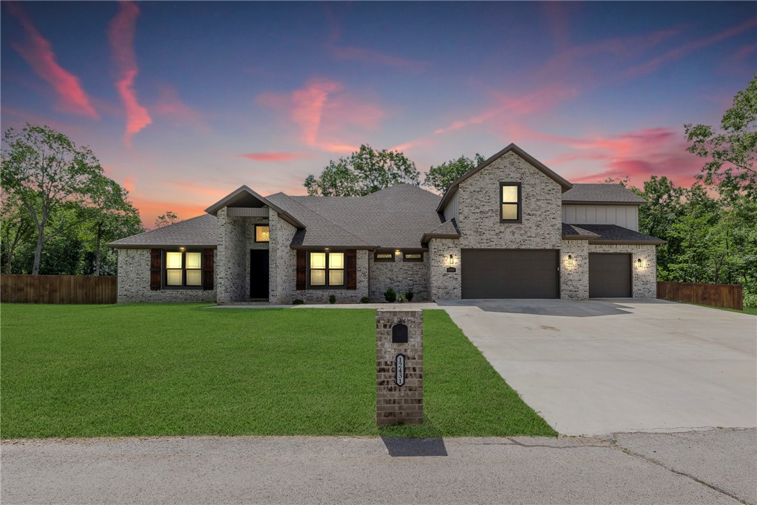 Welcome to your forever home! Situated on 1 acre of flat land in Rogers with mature trees, this home has 4 beds, 3.5 baths, a dedicated office, and a 700+ sq. ft. bonus room. A modern floor plan connecting the kitchen, laundry, primary closet, bath, & bed with quartz countertops. The kitchen boasts amenities such as a butler's pantry, a huge kitchen island, a pot filler, a bottler washer, a custom backsplash, a double oven with an induction cooktop, custom cabinetry, & KitchenAid appliances. The living room features coffered ceilings, a linear gas fireplace, windows with a view of the large backyard, & access to the 600+ sf covered back patio with multiple fans for heat, & a gas fireplace for cooler days. The fenced-in backyard boasts a stained cedar fence. The 1058 sq ft oversized 3-car garage has insulated walls & doors. Lastly, fiber optic high-speed internet is on-site, located only 23 minutes from the home office and 21 minutes from Rogers shopping; this location blends serenity and​​‌​​​​‌​‌​​​‌‌​​​‌‌‌​​‌​​‌‌​​​​ convenience.