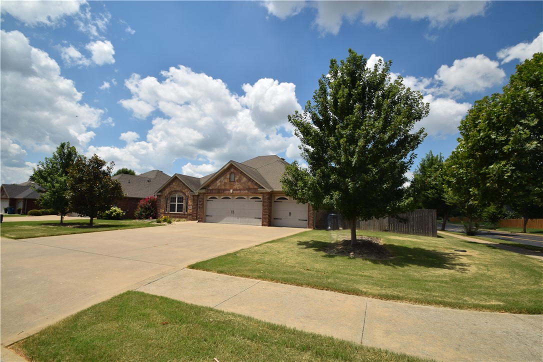Great Bentonville location on a large corner lot with access to a community pool! This all-brick, 4-bedroom, 2-bath home features a welcoming open floor plan with beautiful wood floors throughout and great mood lighting to set the perfect tone. The kitchen includes a pantry for extra storage. Washer, Dryer and Refrigerator included. Outside, you will love the covered back patio and privacy-fenced yard, along with the convenience of a spacious 3-car garage. The location is incredibly convenient, sitting just down the street from the brand-new Creekside Park, which features a splash pad, dog park, and public pickleball courts. It also offers quick, easy access to Schools. This is a smoke-free home. Pets are negotiable with owner approval and an additional deposit.