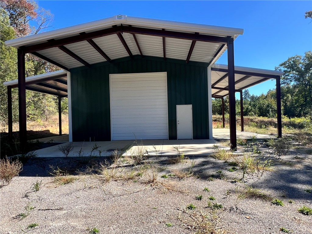 41 Acres with Insulated Shop, Gated Entry & Hunting Land! NEW PRICE on this private 41.43± acre tract just north of Atkins. A 30'x40' insulated shop with large overhead doors, covered concrete side bays, and a covered porch is already in place, making this property ideal for equipment storage, ATVs, hunting camp, RV setup, weekend retreat, or future homestead plans. The land is mostly wooded with established trails, abundant wildlife, and the privacy buyers are searching for. A gated entrance welcomes you to a secluded setting where you can ride, hunt, explore, or simply enjoy owning your own piece of Arkansas. Preliminary utility access work has been started, providing a foundation for future improvements. If you've been searching for acreage with a substantial shop already built, this is one you need to see.