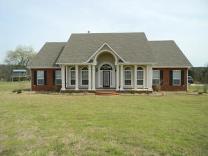 WOW! Beautiful custom built home on 1.7 private acres in Stonegate Addition. Many custom features with tall ceilings, columns, double sided fireplace, separate office/tv room (could also serve as a 4th bedroom), and three car garage. The covered back porch and huge stone patio with fire pit are great for relaxing and enjoying the private back yard. Come see today! (Can also be purchased with additional lot, see MLS 18-746)