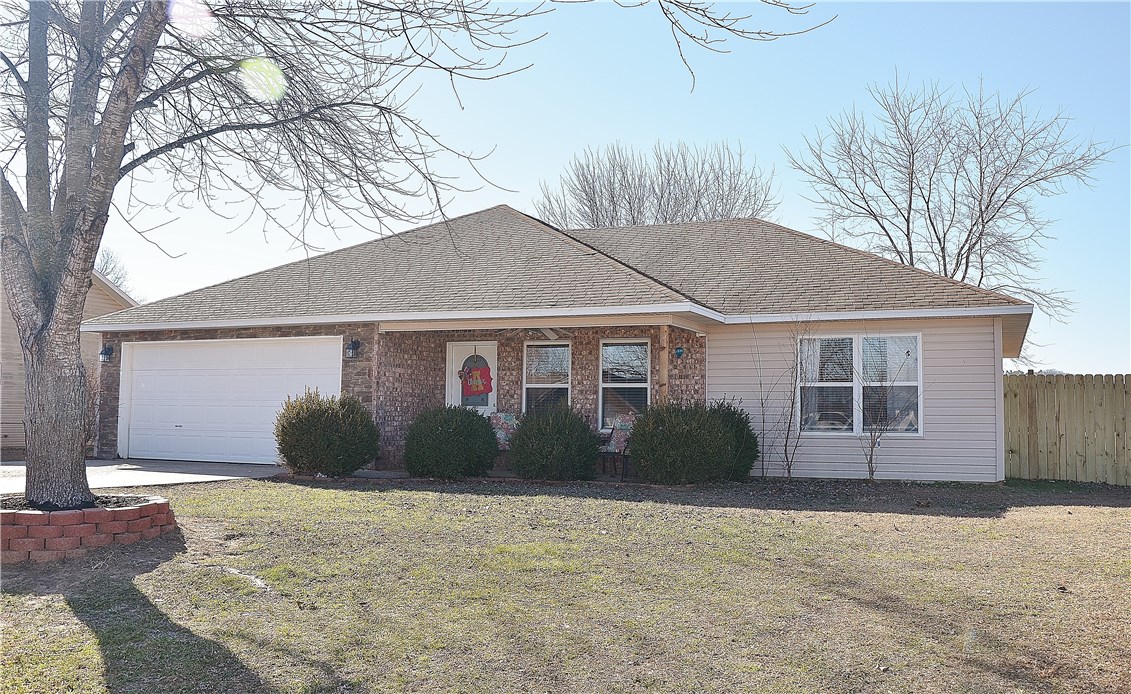 Updated home with a view and large backyard within Elkins city limits (with Fayetteville address and schools). Large kitchen with granite countertops new in 2014 and an oversized sink. Gorgeous wood laminate throughout main living area new in 2014. Lots of storage throughout, with his and hers closets in the master. Large backyard is very private and backs up to a pasture. Home is on a quiet cul-de-sac. Covered front porch and back patio for enjoying the outdoors.