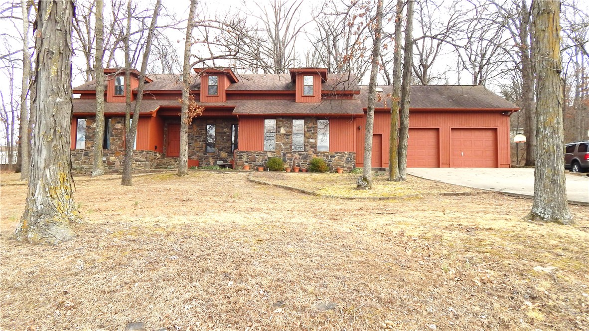 Four bedroom and office or 5BR, 3.5BA. Bedrooms are huge! Plus very large bonus. Living room has corner rock FP, lots of built-ins & french doors to patio & wooded backyard. Huge rooms upstairs w/stairwells on each end of the house. Lots of cabinets in kitchen w/lots of counter space, double ovens, cooktop, formal dining & eat in breakfast room. Master has rock FP & huge master bath with jetted tub. Large laundry room & large garage. HVAC 2 years old & Roof 2009. All on 1 acre of tree shaded lot!