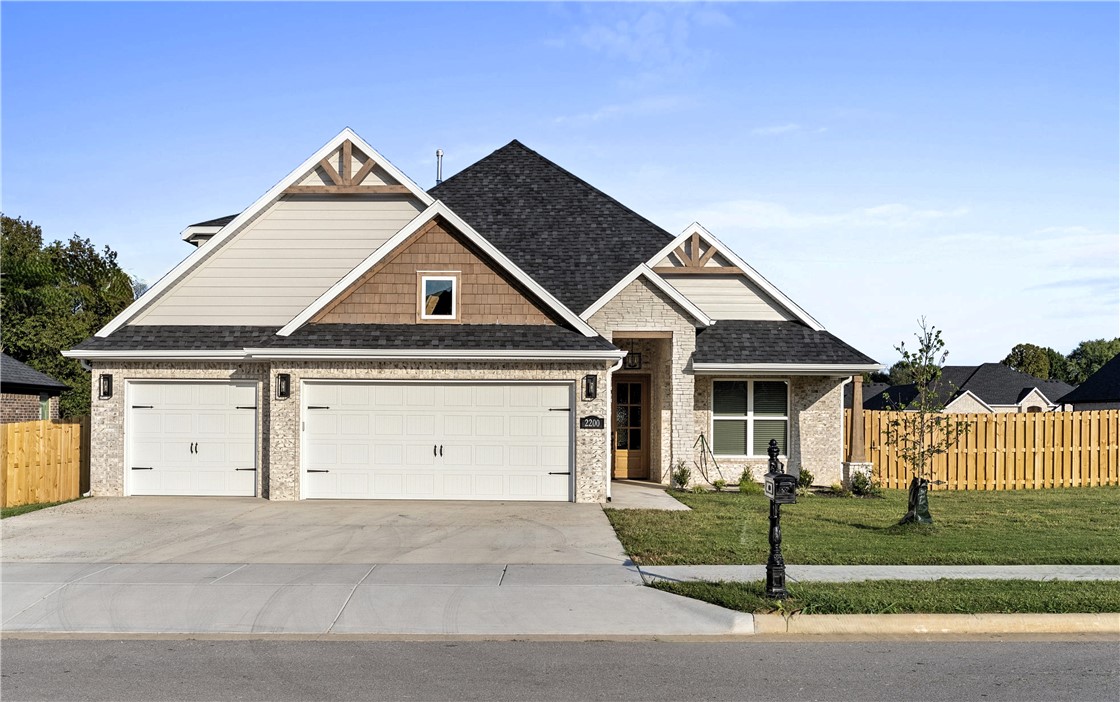 This 4 bedroom model home has 2,696 sqft of well designed space. 3.5 bathrooms allows for versatility and ease of living. Arlington estates is ideally located next to Pea Ridge Schools. Upon entering the foyer Step into a bright and inviting living room with vaulted ceilings and wood beams offering an open-concept layout that flows seamlessly into the kitchen. The kitchen includes a walk-in pantry and a cozy breakfast nook, perfect for casual dining. The primary suite is thoughtfully designed to offer privacy, featuring direct access from the master closet to the utility room giving you both convenience and seclusion. Also located on the main floor is a bedroom ideal for guests or a home office. Upstairs, you'll find two additional bedrooms with a shared full bathroom, providing plenty of space for family or visitors. 3-car garage and covered front and back patio and an outdoor wall gas fireplace for meaningful relaxation. $2500 builder incentive.