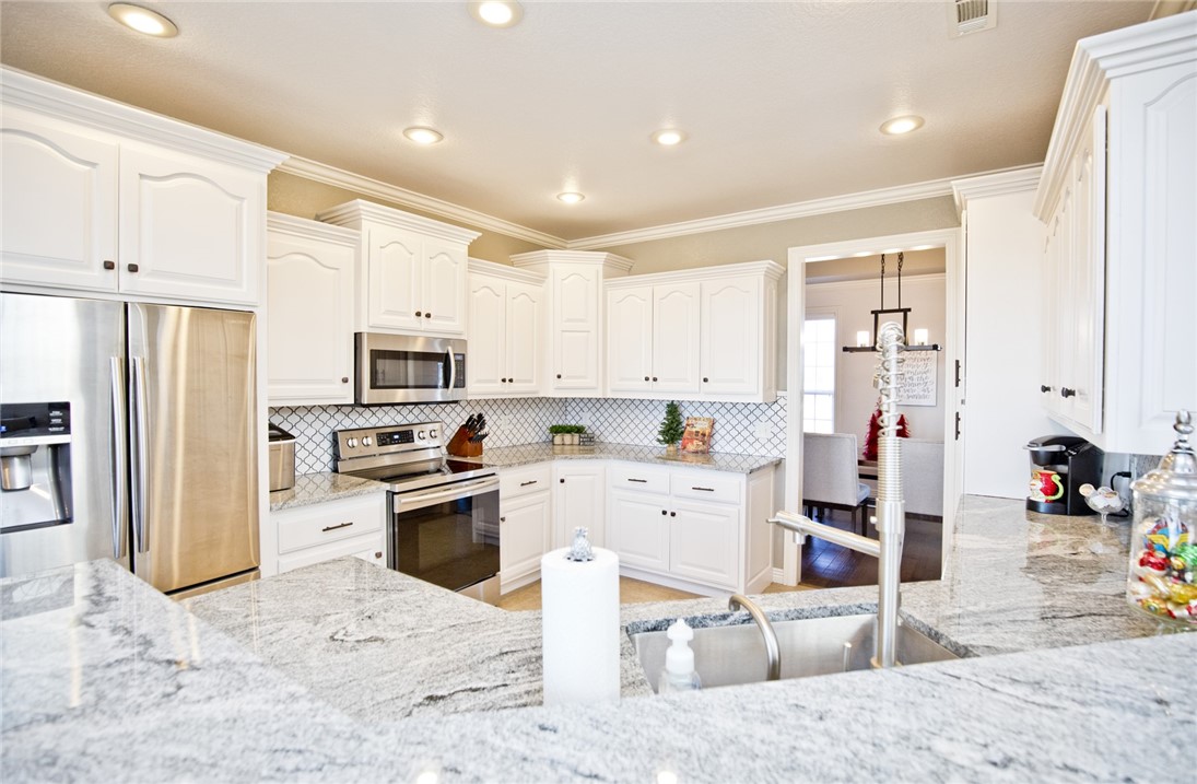What a stunner! This 4 bed + a bonus room home (3 beds down, 1 bedroom, and 1 bonus room upstairs) in Pinkley Estates is a jaw dropper. It's rare to find an updated home, with a brand new custom built master shower, HEATED bathroom floors,  bathroom, kitchen, sitting on nearly an acre with a 4 car garage. You'll love the hardwoods in the living and master bedroom too. As an added bonus, the sellers will throw in some Club Dub Chad Paper. You'll be zoned in the award winning Shaw Elementary, Hellstern Middle, Central Jr High, and Harber School zone.