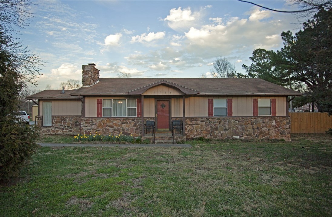 Well maintained home on 1 acre, close to shopping and schools. 3 bedrooms 2 baths, has unique natural rock flooring in kitchen, wood burning fireplace insert with blower, large pavilion in back yard with lawn furniture, 2 car garage. Partial basement.  Lawn care may be included.  Shop building is NOT included.