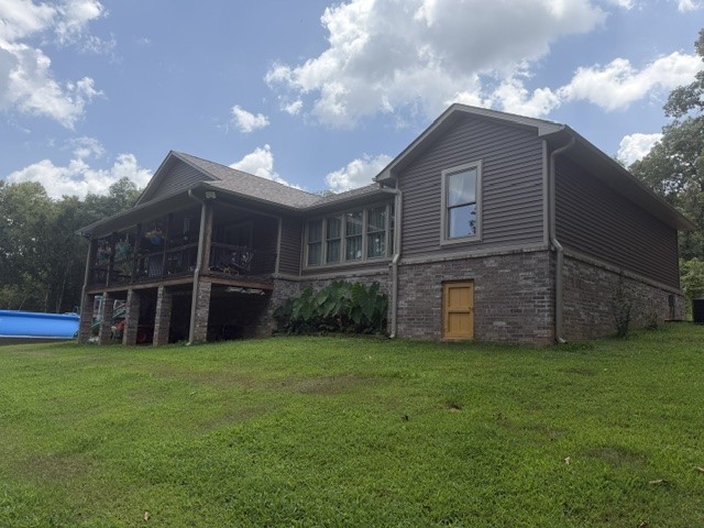 Home with guest house or Airbnb.  Custom built home and guest house provides over 2500 sq. ft. living area; Above grade construction and material.  Located on 16.98 acres with additional acreage available.  Vinyl siding and brick exterior, architecture shingles, leaf guard gutters, covered and open deck, attached 2 carport/1 garage; Pella windows, lots of wood trim, mud room with 1/2 bath, master bath with large shower, 2 Bedrooms with Jack and Jill bath, solid pine doors, hickory cabinets and flooring.  Guest house provides additional 560 sq. ft. living area, two bedrooms, one bath, stained/cut concrete floor.
