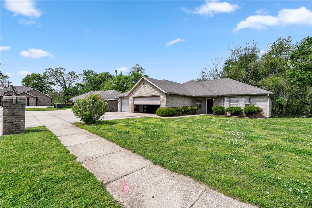 **Please note this property will require significant remodeling and does not qualify for traditional financing — cash or renovation loan offers only.  
There once was a home on Hunter Allen Drive,
With 4 beds and 3 cars — what a jive!
It needs a little love,
Like a hand in a glove,
Flip it right and watch your equity thrive!
Opportunity is knocking at 202 Hunter Allen in Springdale! This 4-bedroom, 2-bath brick home sits on a level corner lot in Wilkins Subdivision, offering 1,661 sq ft of living space with a spacious 3-car attached garage. Built in 2007, the layout features an eat-in kitchen, walk-in closets, ceiling fans, and a cozy gas fireplace in the living room. Step outside and enjoy the deck — perfect for relaxing or entertaining. Located near top schools, parks, shopping, and medical facilities, the location truly can't be beat.  Priced at $235,000, this is your chance to build serious equity and make it uniquely yours!