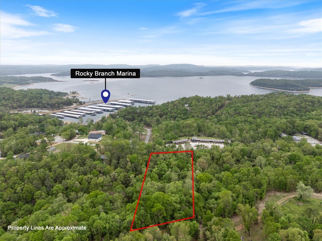 Price Improvement! $26,000 price reduction on lot 18. Great location for a home or vacation residence just 2 minutes from Rocky Branch Marina. It is one of two lots that are available side by side located on Park Road. Hard to beat this location on a paved street with water and utilities. Enjoy watching the deer and wildlife from your back porch. Plus, if you add a rooftop balcony, it will provide a unique outdoor experience of Beaver Lake for get-togethers. Realize ADDITIONAL $20,000 price reduction with the purchase of both lots 18 and 19 of Parcel 15-09829-000 for only $178,000, realizing a total price reduction of $72,000 for both lots. See MLS# 1338090 lot 19. Survey of lots attached along with perc test.
