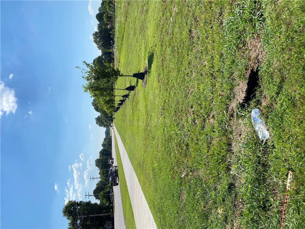 Development potential w/ frontage on Wedington. 1.9 miles to I49, 1.1 miles to Rupple Rd. All utilities on site. Curb & gutter streets on 2 sides. Level lot.