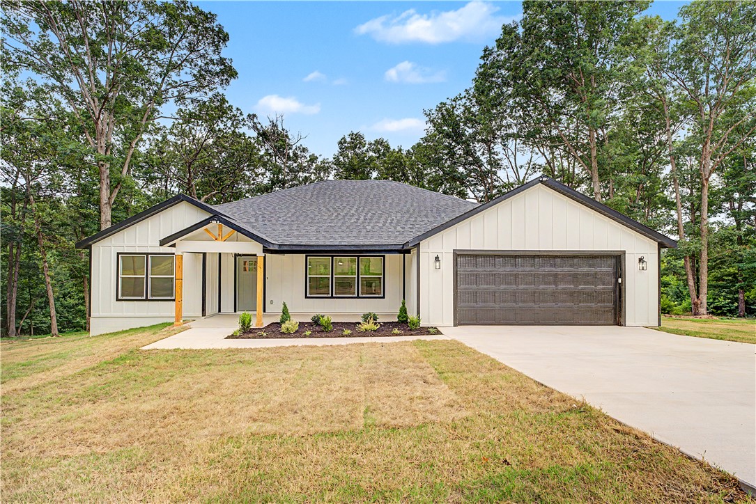 Experience quality craftsmanship and modern Ozark living in this custom-built home featuring a thoughtfully designed floor plan and premium finishes throughout. The spacious open-concept layout showcases stunning vaulted ceilings accented with beautiful pine beams, creating a warm and inviting atmosphere. The kitchen is equipped with elegant marble countertops, while durable luxury vinyl plank (LVP) flooring flows throughout the home for both style and functionality. Exterior features include low-maintenance Hardie Board siding for lasting curb appeal and durability. Enjoy the convenience of OzarksGo internet and cable services, providing reliable high-speed connectivity. Legal description and parcel number to be determined at closing.