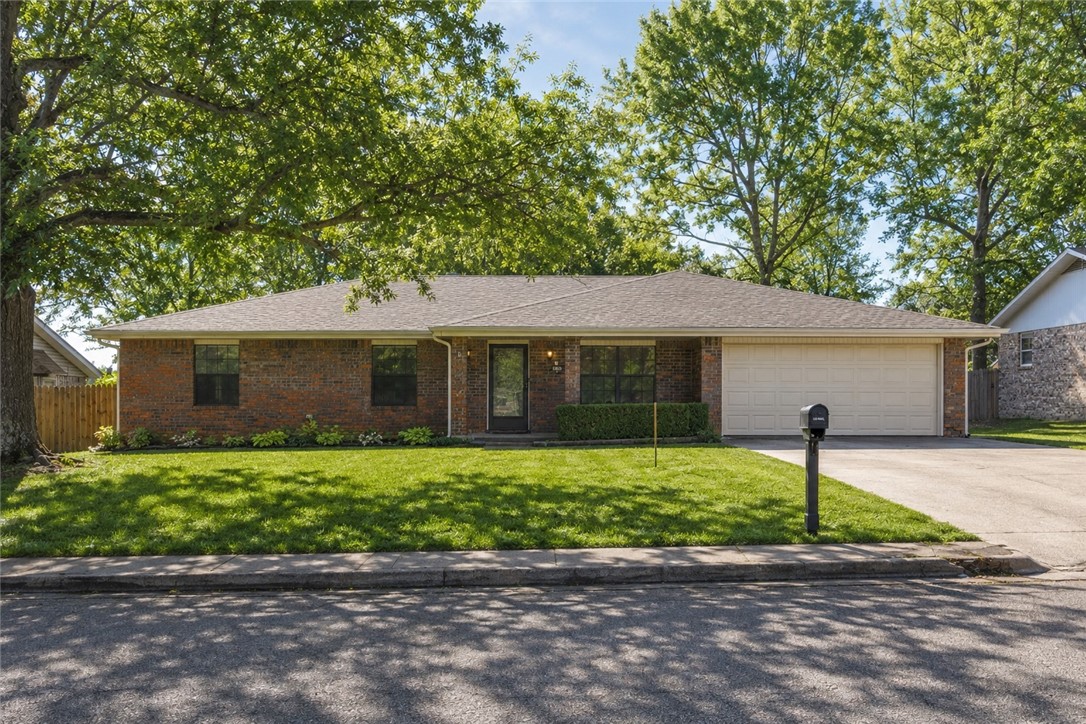 Welcome home to this beautifully maintained ranch-style retreat in the heart of Springdale—where comfort, convenience, and modern updates come together effortlessly. Ideally located beside the Randall Tyson Sports Complex and just minutes from Arvest Ballpark, this home places you at the center of Northwest Arkansas living with quick access to the Don Tyson Exit. Inside, you’ll find a thoughtfully refreshed interior featuring a brand-new roof, stylishly updated bathrooms, and a sleek, modern kitchen with generous cabinet space—perfect for everyday living and entertaining alike. The inviting layout offers easy, single-level living with a warm, welcoming feel throughout. Whether you’re a first-time buyer, downsizing, or investing, this move-in-ready gem delivers lifestyle, location, and lasting value. Opportunities like this don’t come often—schedule your private showing today and experience it for yourself.