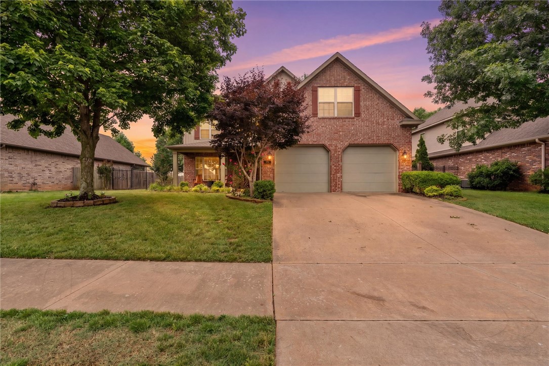 Modern updates, functional design, and an unbeatable location come together in this inviting Fayetteville home! Soaring 20-ft ceilings and abundant natural light create an open, airy feel, while the layout offers comfort and spaciousness ideal for family living. The kitchen features a new GE Cafe' refrigerator, GE Cafe' dishwasher, and new GE double ovens (w/ convection) offering a sleek, updated style perfect for entertaining. Major improvements include a new roof (2020), two new HVAC systems (2023), and a tankless water heater (2023), providing efficiency and peace of mind. The oversized primary suite offers a private retreat, complemented by 2 more well-designed bedrooms upstairs for family and guests alike. Outside, enjoy a fenced backyard, covered patio, irrigation system, and inviting outdoor spaces ideal for relaxing or hosting guests. Conveniently located near Holt and Holcomb schools and just minutes from Clabber Creek Trail, this home combines modern comfort with everyday convenience.
