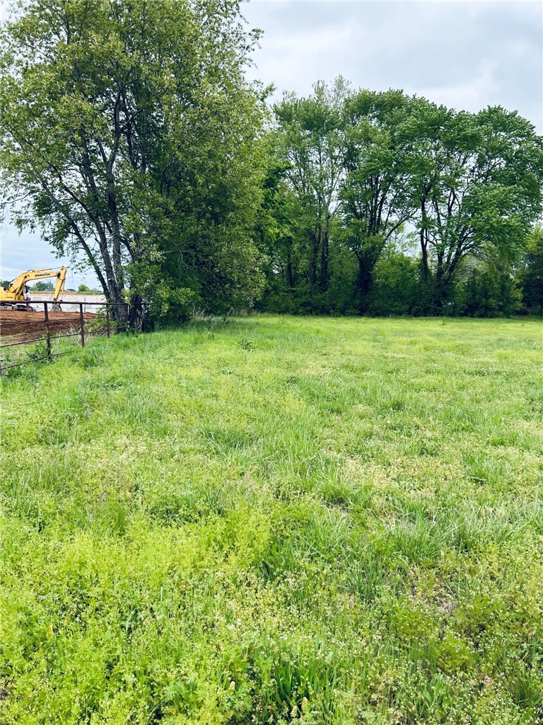 Rare opportunity, 4.85 acres in developing area, all utilities available, commercial area, street frontage access and street access to rear of the  property. Located in commercial district of Centerton, highway 102 frontage. Rapidly developing area, adjoins largescale development. Suitable for business, storage units ,restaurant, strip shopping, town homes or apartments, etc. Small area crossing the front of the property is included in 100 year flood plan. That area can be used for parking lot.