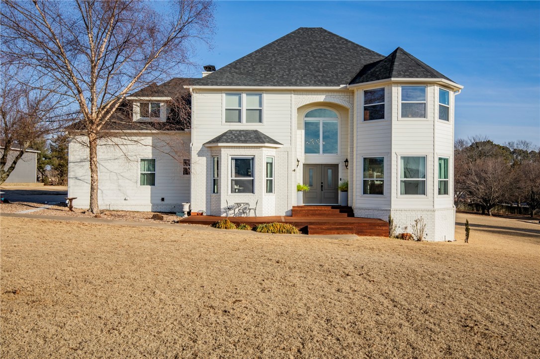 Welcome home to this beautiful property in Ridgemonte View, offering stunning Boston Mountain views and an unbeatable combination of comfort and convenience. Set on a spacious, open lot, this home invites kids to play, pets to roam, and families to gather. Once inside, you'll find an impressive entryway with hardwood floors and large windows in every direction. The first floor also features an office with double doors, full bath, large laundry, and a wood-burning fireplace in the living room. Major updates include a new roof, gutters, exterior siding, cedar deck, front doors, and paint all within the last five years. The upstairs bedrooms capitalize on the views in every direction and a giant bonus space could serve any purpose well! Located in a highly desirable area only a mile from Mission and Crossover with excellent schools, the neighborhood also features a one-mile walking path around the perimeter, ideal for family strolls or jogs. Convenience, space and views... This is what you've been waiting for!