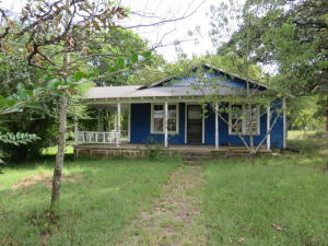 Great Home sitting on 1.5 acres m/l. Lots of potential with this home. Spacious inside and out. Covered porch, deck, and a nice sized outbuilding. Come see this one today. Looking for an owner finance? This owner is willing to consider owner financing with large down payment.