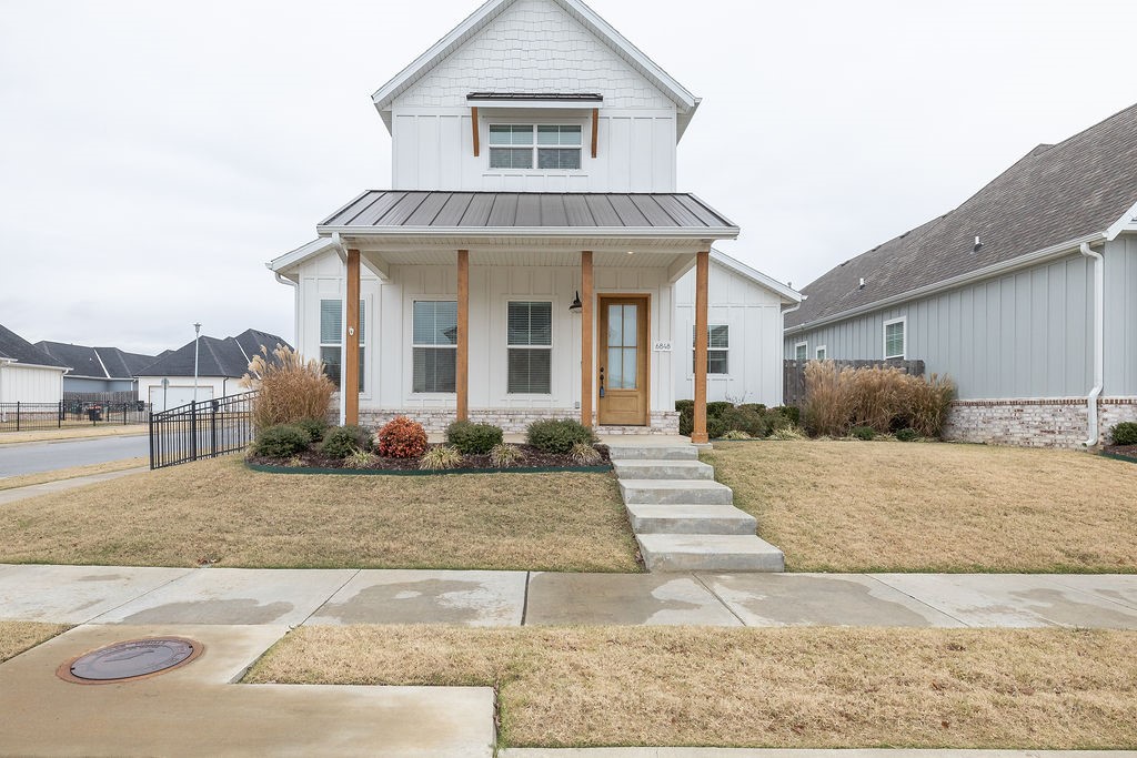 Move-in ready, spectacular one-owner home on a corner lot in Cottage at the Park! Enjoy POA-covered lawn care, community pool, clubhouse/pavilion and firepit/game area within a short walk to the 120-acre Shaw Family Park with walking trails, fishing lakes, a dog park, tennis courts, and direct access to the Razorback Greenway. This former model home features 10' ceilings, quartz counters, a primary suite on the main floor, along with an extra-large living/family room and an eat-in kitchen with over oversized island, a fantastic laundry room, plus an office/hobby room. 2 bedrooms and a full bath upstairs. Tons of storage throughout the entire house.  8' doors, engineered hardwood flooring, upscale fixtures, and modern features throughout. Must see!
