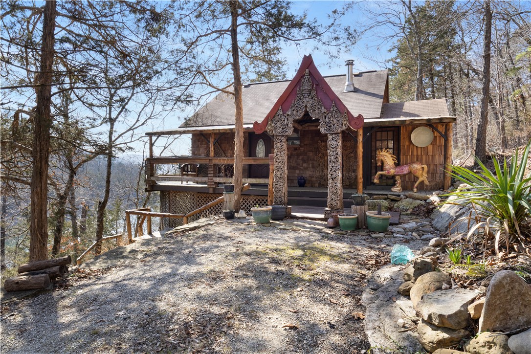 Waterfront Cabin in Private Waterfall Cove on Beaver Lake w/ 3.17 Acres, Dock Slip Available & Rare Future Opportunity! Tucked inside a privately held cove on Beaver Lake, this 3.33-acre property offers a setting that simply cannot be recreated. A year-round waterfall flows into the cove below, creating a peaceful, meditative atmosphere you’ll feel the moment you arrive. The 1-bedroom, 1-bath cabin—crafted by local artisans—is perfectly positioned to take in the view, with over 900 sqft of elevated decking overlooking the waterfall and water’s edge. With multiple potential building sites, the acreage offers the flexibility to expand, create a private compound, or hold as a long-term asset. .25 mile away, is a dedicated boat slip is available. With a first right of refusal on the remaining portions of this privately held cove—featuring additional acreage, a residence, and 2-slip boat dock—offering a rare opportunity to expand ownership over time in one of Beaver Lake’s most gorgeous settings.