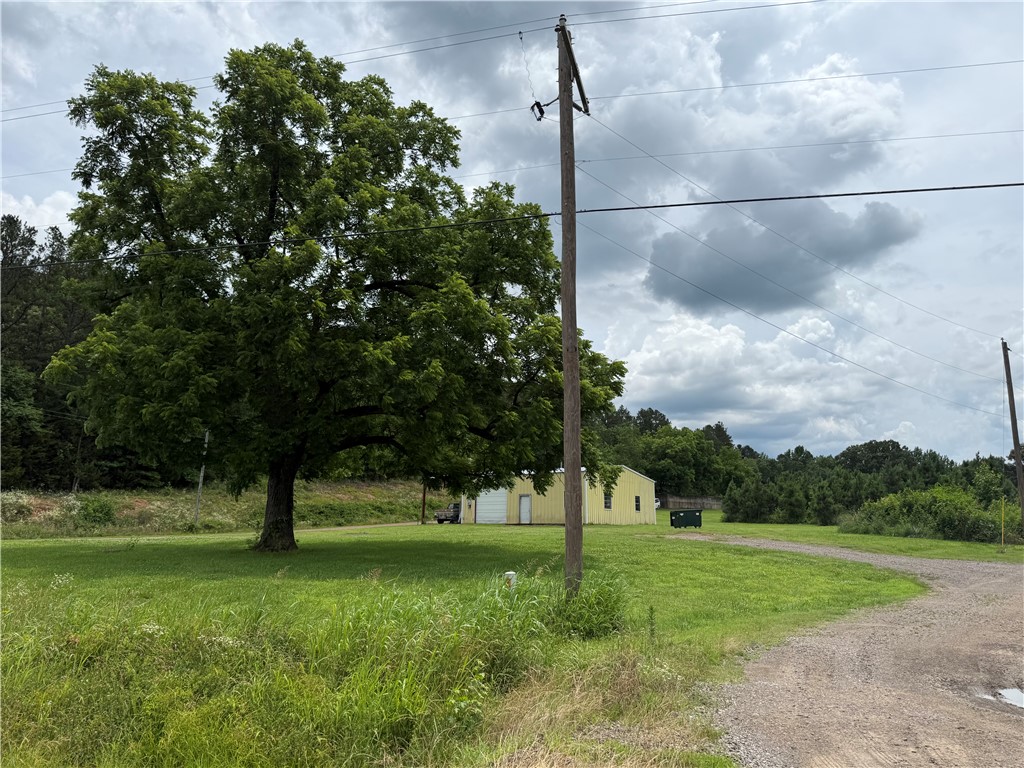 Discover 4 beautiful acres of flat, usable land just off Hwy 27, offering endless potential for your home, business, or both. This rural property features a huge 37x40 shop, two fresh-water wells, and plenty of open space to build exactly what you need. Buyers will need to add a driveway, but the layout makes access simple and flexible. Whether you’re dreaming of country living, a workshop-based business, or a combination of the two, this property gives you the freedom to create it.