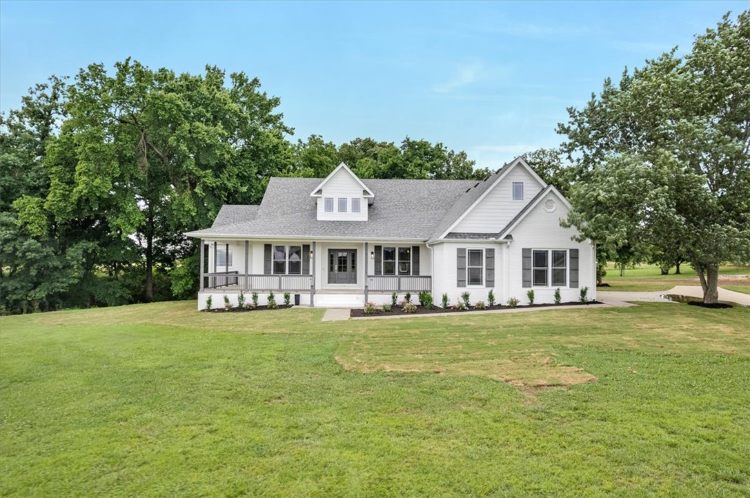Completely remodeled from head to toe, this 3,443 sq ft gem is just waiting for a new family. Sitting on 1.32 acres, and the original home on the acreage that has been developed into a new subdivision called Autumn Ridge, Tontitown. You'll be nestled in with other similar size home, all on one acre, that will be built over the coming year or so. This home has new paint, appliances, flooring and so much more. Screened in back patio, spacious front porch and the enjoyment of deer running through your yard quite often. Just 10 minutes or do from Exit 72 on I-49 and only 2 minutes from the new interchange of Hwy 412 and Hwy 612. Five bedrooms, 3 full baths and 2 half baths and a formal dining room. Come see this beautifully update home and make it yours today!
