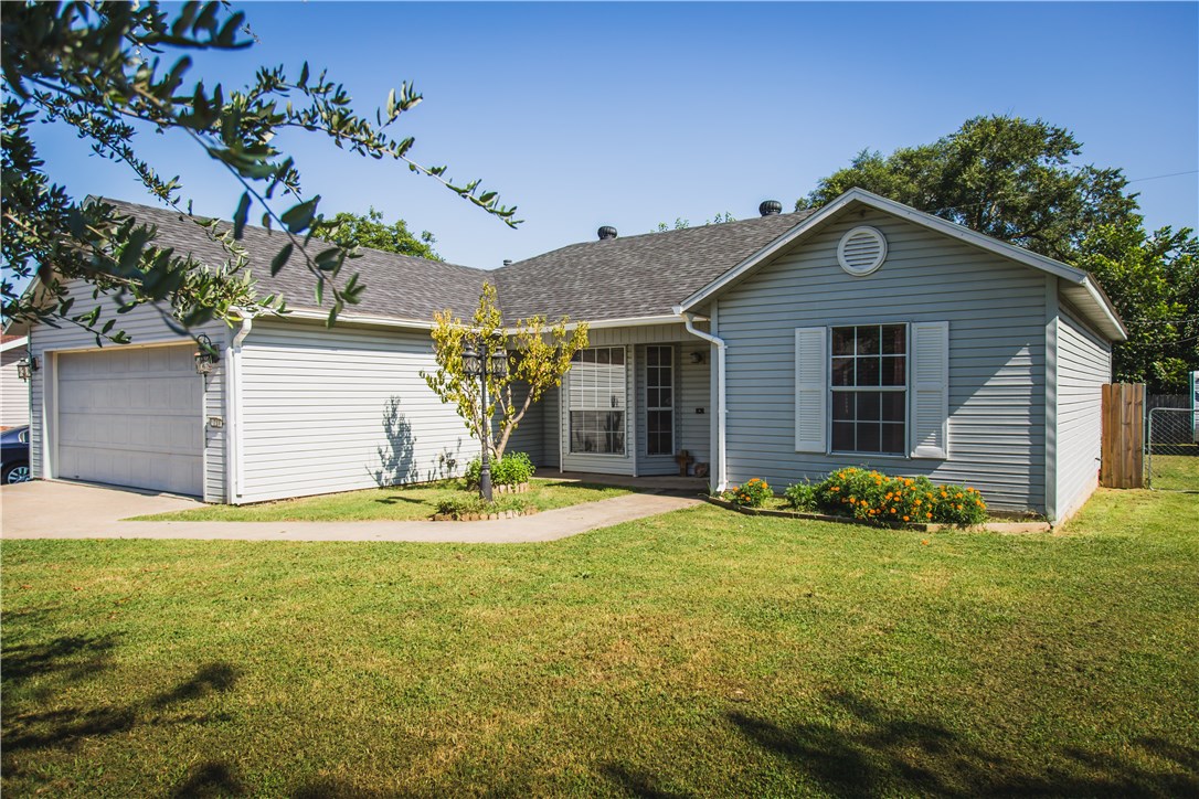 Great price on this 3 bedroom, one-level home in Lowell! Architectural shingle roof new in 2015, maintenance free laminate flooring in all main living areas, split floor plan, and great backyard space! Location is convenient to 71B, I-49, shopping, restaurants, and schools.