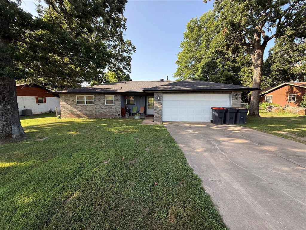 Welcome to this spacious 3 bed, 2 bath home offering 1,754 sq ft of comfortable living space. Situated on a generous 0.46+/- acre lot shaded by beautiful mature trees. The large and inviting living room features a classic wood burning fireplace, making it the perfect centerpiece for gatherings. The backyard features a concrete patio along with additional concrete slabs that are ideal for setting up outdoor seating, a basketball hoop etc. A storage shed also conveys with the property for all your extra tools and equipment. With a newer roof and gutters installed in 2021, this home provides excellent structural peace of mind. The property is being sold as is, offering a fantastic opportunity for buyers looking to bring their own personal touches and updates to a property with great bones.