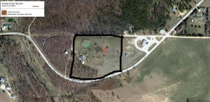 Very pretty 10 acres with a nice blend of woods & pasture.  Many extras including rural water & septic on property along with phone & electric.  Land lays extremely nice.  Near the Buffalo River Natl. Park.  1 mile.  Pond.  Barn.  Beautiful building sites.  Paved road frontage.