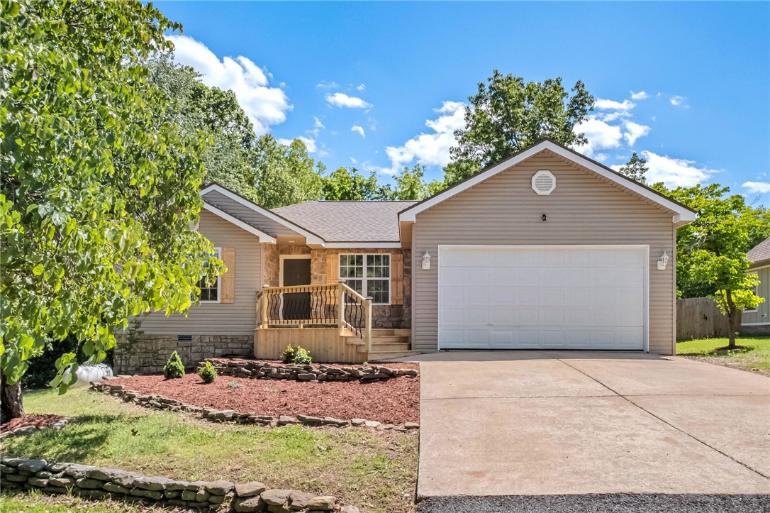 Charming home nestled amongst mature trees with beautiful, clean landscaping. Welcoming front porch opens up into a spacious living room with a cozy fireplace. Kitchen area looks out on large backyard and tall trees. Several updates listed below. This home is a must see!  
-Roof replaced in April 2024
-New HVAC in March 2025
-New propane water heater
-Fresh paint
-Solar panels convey 
-500 gallon propane tank is owned by
-Fireplace is now electric
