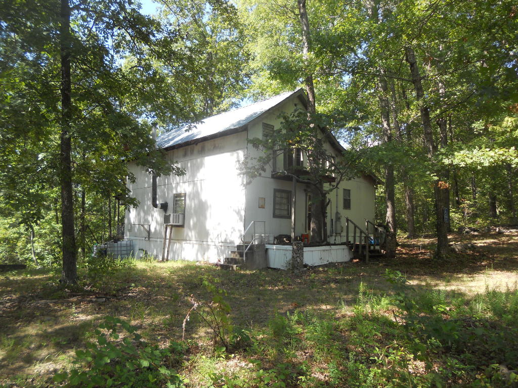 Escape the world with complete privacy and seclusion on this 5 acre tract on top of a mountain with beautiful views all around. End of the road privacy, and no neighbors except for the natural wildlife will allow you to enjoy the solitude and beauty of this property. Two comfy cabins, both 2bed/1bath both with electricity and natural rain water catchment for clean water source. Property near Buffalo Nat'l river for swimming and floating, and near Erbie park. End of the road location, great views! Seller is offering owner financing.