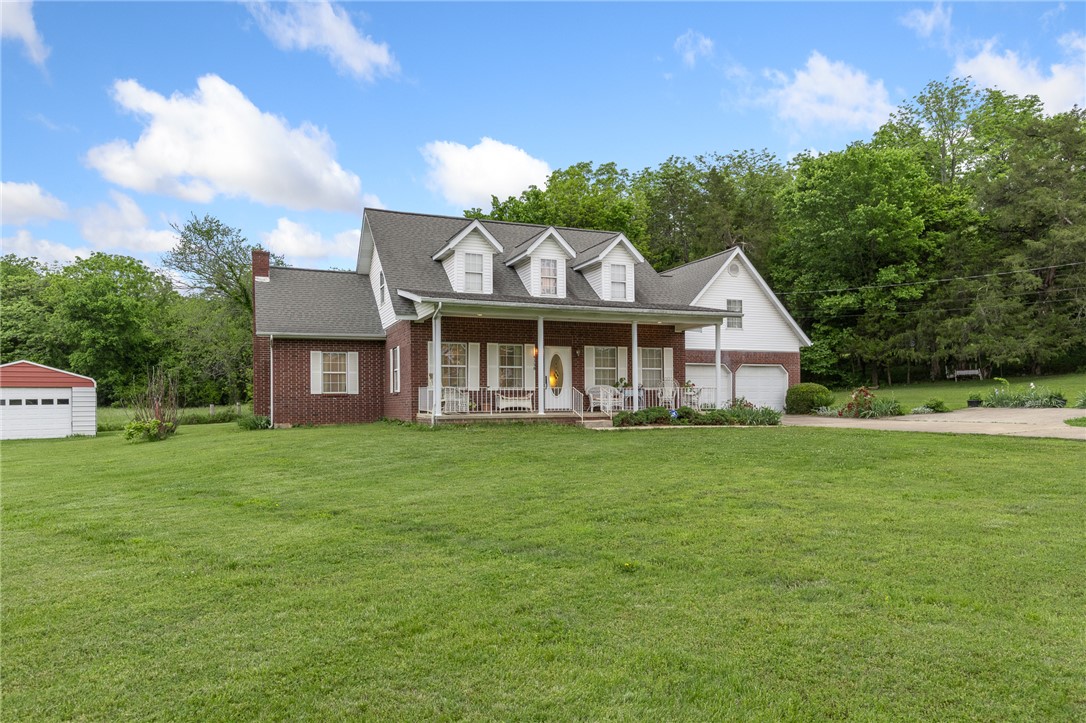Driving up, you feel it right away, this kind of quiet just hits different & it draws you in! Tucked into a spacious neighborhood but only minutes from town, this home offers the kind of setting buyers are always hoping to find—but rarely do. Sitting on 1.14 m/l acres, you’ve got space to breathe & room to spread out. The yard is something you notice immediately. It is lush, green, almost like carpet & the perennial flowers are established! And that front porch… it’s the kind you use. Morning coffee, evening wind-down, all of it. You’ve got a 2-car attached garage, plus a detached garage & an outbuilding—so whether it’s storage, hobbies, or projects, you’re covered. The 4th bedroom & 3rd full bath are part of a separate apartment—perfect for guests, in-laws, or that kid that moved out & came back (it happens). It gives everyone their own space without being on top of each other. It’s just one of those properties that makes sense when you see it. Clean, cared for, peaceful and easy to picture yourself living here.