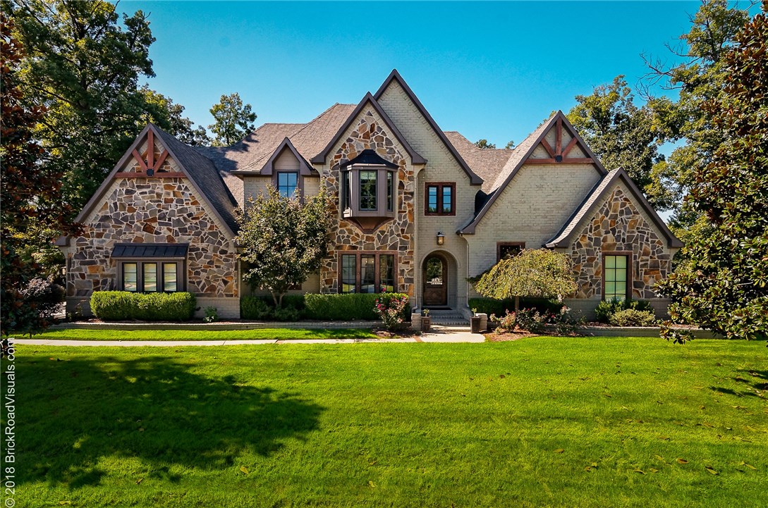 Located in the gated golf community of Clear Creek with 24 hour security, this beautiful home features an open floor plan with two living areas, 4 bedrooms with Master and additional bedroom on main level with 2 bedrooms/2 bathrooms and media room up.  Gorgeous office with built-in desk, cabinetry and shelves.  Hand scraped hardwood floors throughout and open kitchen boasts high end stainless steel appliances, stunning wood cabinets, granite countertops, two islands and butler's pantry off the formal dining room.  Backyard is perfect for entertaining with a covered deck and an open patio space a few steps down.  Beautiful landscaping in the front and back with a three car side loading garage.