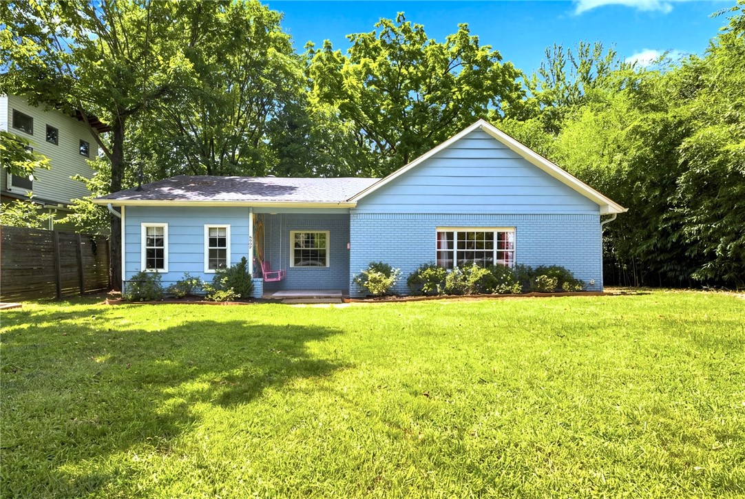 Welcome to one of Fayetteville's most unforgettable homes. Located in the heart of the Historic District, this nationally recognized property earned an Airbnb OMG! Fund award for its whimsical, candy-inspired design, celebrating its creativity and one-of-a-kind character. Whether you choose to embrace its playful personality or reimagine the space with a more understated palette, the major updates are already complete. Enjoy luxury vinyl flooring, beautifully renovated bathrooms, and thoughtful improvements throughout. A bonus room offers flexibility as a third bedroom, second living area, home office, or playroom. Set on an oversized lot just minutes from downtown, there's plenty of room to garden or entertain in the oversized backyard - an increasingly rare find in this sought-after neighborhood. Homes in the Historic District are always special, but this one stands in a category of its own. Rich with character, full of possibilities, and impossible to forget, 837 N. Olive is ready for its next chapter.