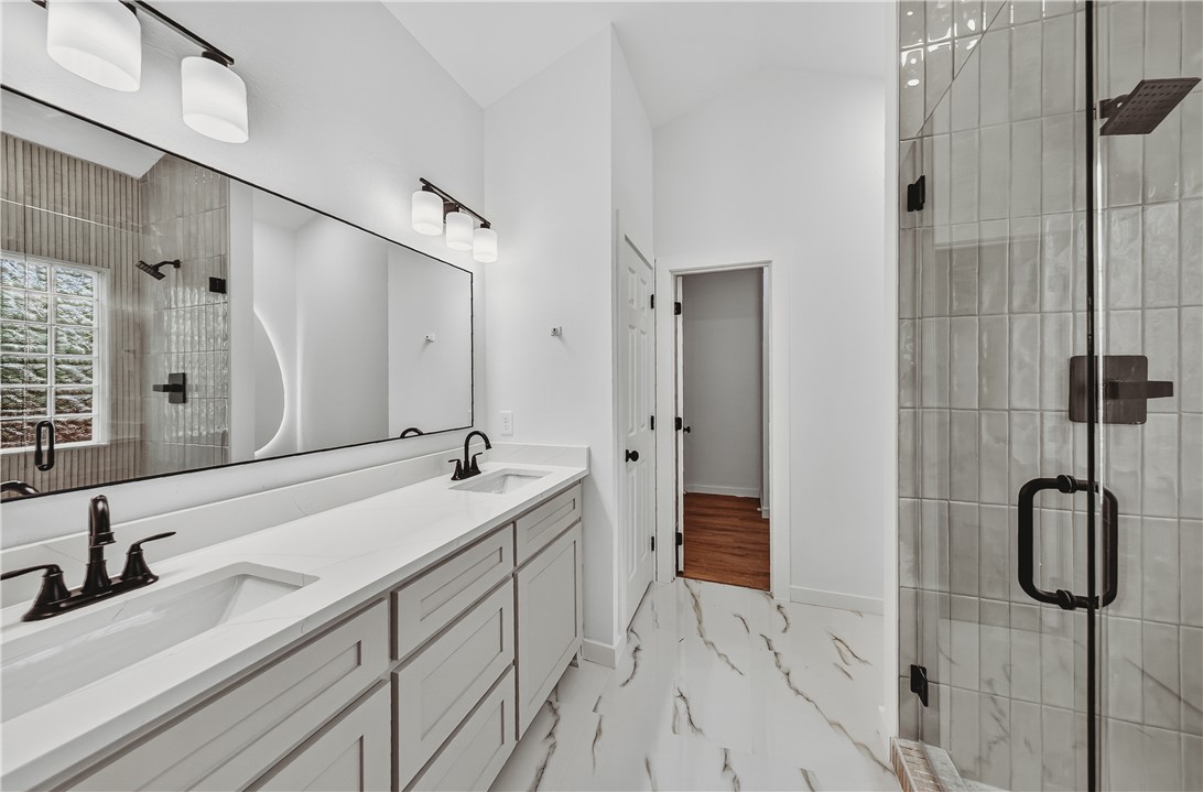 Welcome to the completely reimagined Lynn Drive! Nestled right in the heart of Pea Ridge, this total-remodel masterpiece offers the ultimate blend of modern luxury and unbeatable convenience. Enjoy a vibrant lifestyle just minutes from local dining, groceries, medical center, Carr Street Park, and schools.

No detail was spared in this top-to-bottom renovation. Features include a brand-new roof, HVAC, furnace, windows, doors, garage door opener, and freshly updated landscaping. Inside, you'll be greeted by an abundance of natural light, fresh paint, and stylish new flooring and designer lighting throughout. The stunning kitchen and bathrooms boast premium quartz countertops, highlighted by a gorgeous new walk-in tiled shower. Cozy up by the beautifully updated fireplace or relax in your beautifully shaded backyard. Truly a turn-key gem!

Prior to renovation, the home required extensive clean-out and sanitation. It has since been thoroughly remediated, sanitized and fully renovated.