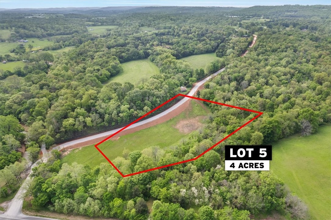With gently rolling hills and a creek running along the edge, experience the peace and tranquility of your own private retreat on one of four beautiful building lots!  Escape the bustle of town but enjoy the convenience of being just minutes from excellent Fayetteville schools and shopping.  Ranging from 2-5+ acres, each lot has its own unique features allowing you to build the perfect home to suit your needs and taste.  New well is included for each lot, utilities are at the road.