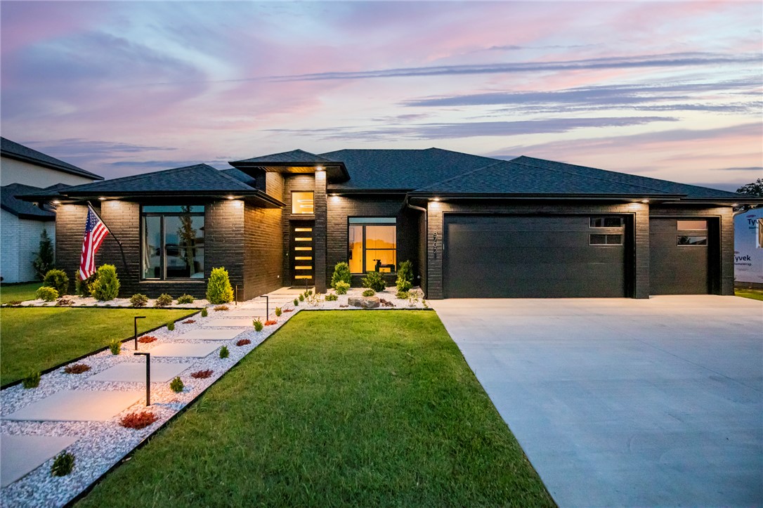 This 2023 NWA Parade of Homes Gold Award winner is a rare opportunity to own a residence where every decision was made without compromise, every finish was chosen with purpose, and every detail has been maintained with the same pride that built it. Best of all, it's offered fully furnished to perfection. Inside, hand-selected wood floors flow beneath custom low-voltage accent lighting, all controlled by a fully automated Lutron lighting system. Luxury custom cabinetry, floating vanities, and a magazine-worthy bonus room with a dry bar elevate each space. Outside, manicured landscaping surrounds a fully automated heated pool, outdoor fireplace, built-in kitchen with grill, mini fridge, and pullout trash, plus a private infrared sauna. Even the epoxied 3-car garage with hot and cold water reflects the home's uncompromising quality. This home has been maintained to the highest of standards. Opportunities to own a home of this caliber in Scissortail are exceptionally rare—don't miss your chance to make this one yours!