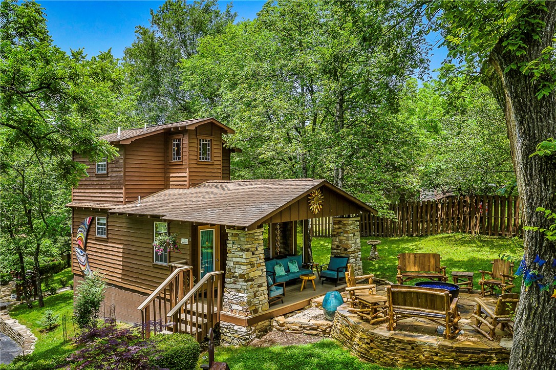 The Woods Cabins is a lodging property with five cabins, comprising 5 individual guest units within a short walk of downtown Eureka Springs, AR.  Located on one acre of pristine and well manicured property, the Woods Cabins is a 5 star resort with impressive accommodations including inside the units and on the grounds.The guests can enjoy a large, detached screened gazebo with a 6 ½’ octagonal hot tub. Wow!  As well as a gorgeous fire pit to relax at the end of the day.  Once you have stayed at The Woods Cabins, you will return time and time again.  The owners have done an outstanding job of providing cozy yet elegance throughout.  Importantly, the owner’s residence at the property is a very well sited two bedroom, one bath home with a full kitchen, living room, office, and deck. The combination makes this a very desirable property for someone wanting a viable small business and a great home to live in.  2023 Travelers Choice awarded by TripAdvisor!  Top 10% globally!