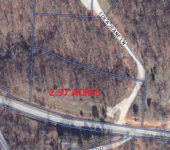 Build your dream home or business office just outside of town! Large 2.57 acre lot with Highway 12 frontage. Beautiful mature trees abound on this gorgeous lot only 5 minutes to downtown Rogers. Prairie Creek marina, Beaver Lake, biking trails and hiking trails are only minutes down the road. This property offers the ability to get "out of town" while still having the amenities of living in town. No HOA restrictions and water available at the street. Additional 2.12 acres available under MLS#1352106.