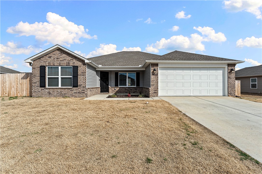 Like-new and move-in ready, this beautiful 4-bedroom, 2-bath home built in 2025 offers modern style, thoughtful upgrades, and a location close to it all. From the inviting covered front porch to the bright open-concept layout, every detail is designed for comfortable living and easy entertaining. The kitchen features stylish gray cabinetry, sleek black countertops, a pantry, generous prep space, and energy-efficient appliances. Durable LVP flooring runs throughout with no carpet, plus LED lighting, blinds on every window, and ceiling fan wiring in every room. The oversized primary suite is a relaxing retreat with a beautifully finished bath and tiled walk-in shower. Secondary bedrooms are well-sized and flexible for guests, kids, or a home office, adding comfort and versatility daily. Outside, enjoy a wooden privacy fence perfect for pets, play, or backyard gatherings. Skip the wait for new construction and enjoy like-new living near shopping, schools, dining, and more. Schedule your showing today!