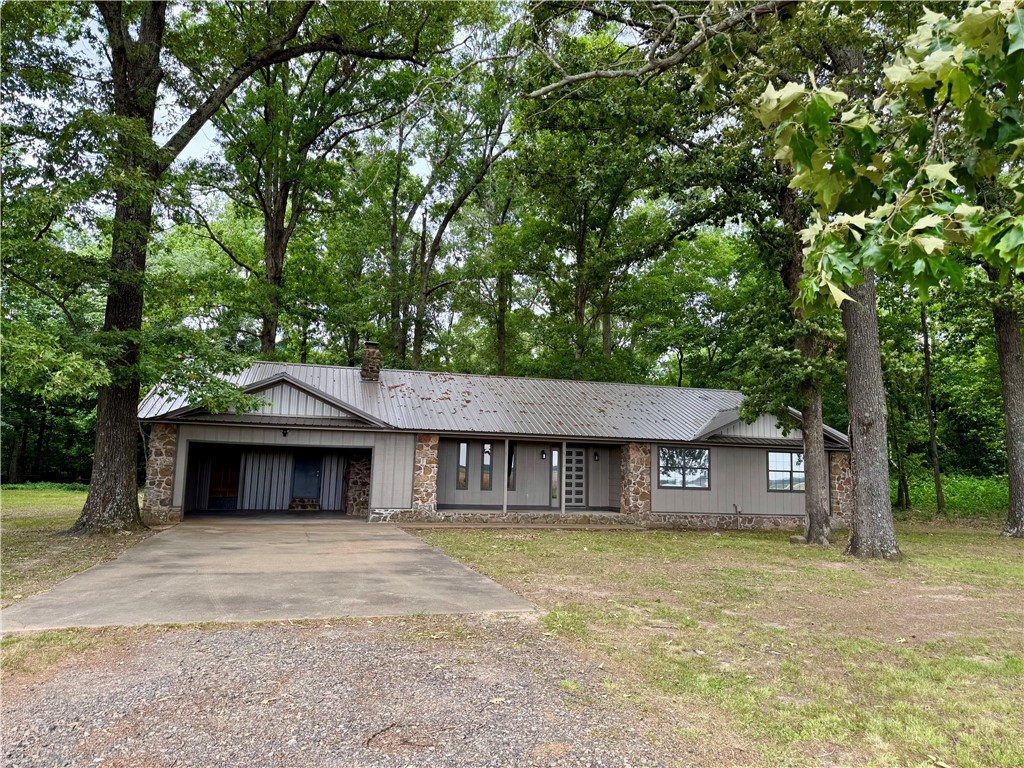 Charming, secluded, custom built house from 1979, renovated in 2025, situated on 2.75 acres more or less, surrounded by trees and open fields. Property features include 3 large bedrooms with walk-in closest, an eat in kitchen, a real wood burning fireplace with tile and stone chimney with insert, a large pantry, a well sized laundry room, and a in ground garden tub.  The exterior features low maintenance cedar siding and natural stone.  Let's talk about the updates, fresh paint, new flooring, new metal roof and newer HVAC (ca. 2024). Country living at it's finest, only 20 minutes to Searcy!
