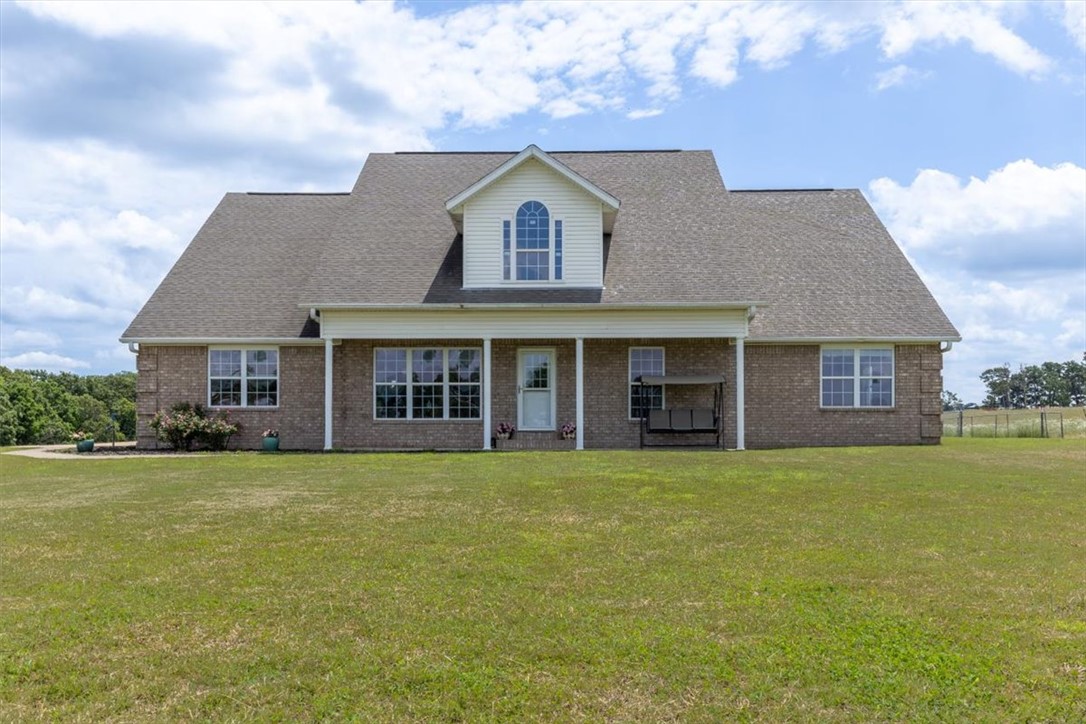 Escape to the country with this 19.46-acre property offering endless possibilities for a hobby farm, horse property, or a peaceful rural retreat. The home features a large kitchen with ample cabinetry and plenty of room for gathering. Two primary suites offer flexible living arrangements. One suite offers a walk-thru walk-in closet with access to the laundry room, the second includes both interior access and private entrance from the garage and patio. Large walk-in closets throughout. Unfinished upstairs attic area is plumbed for utilities and offers potential for an additional bedroom, bathroom or bonus room. A geothermal HVAC system provides energy efficient heating and cooling. The home features hurricane-clipped rafters and reinforced foundation connections for added structural integrity. This property offers the opportunity to create your own country oasis.