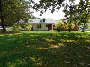 Updated  home with deck, pool, over sized garage with attic storage,Realtor owner.