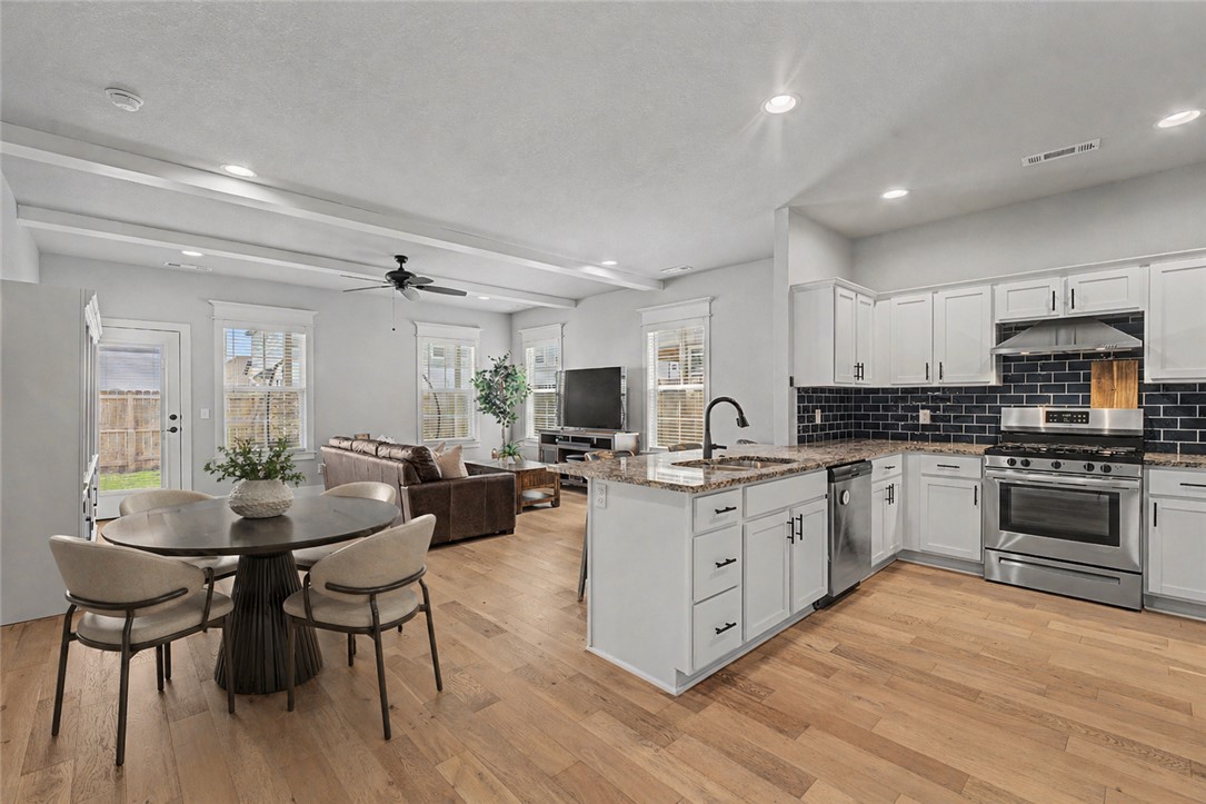 Location Location Location! This impeccably maintained 3 bedroom 2.5 bath home just hit the market and you don't want to miss out on this one. Located just 3 minutes to I49, around the corner to Walmart Supercenter, The Promenade, The AMP, and all things entertainment. Exterior has brick and hardy siding and is professionally landscaped. This smart home features blonde engineered hardwood flooring, custom molding and beams, flexible dining spaces, front and back covered porches, and open layout. The primary suite is located downstairs and has a soaking tub and a separate tiled shower. The half bath is located on the first floor along with the laundry room. Upstairs are 2 spacious bedrooms and a large bathroom with double sinks and granite countertops. Comfort zoned HVAC has 3 zones in the master, main living, and upstairs. Relaxing back yard fully fenced and comes with a Tuff Shed for mower and lawn equipment. Clean as a whistle and completely turnkey! Seller is willing to give a $4000 credit towards closing costs!