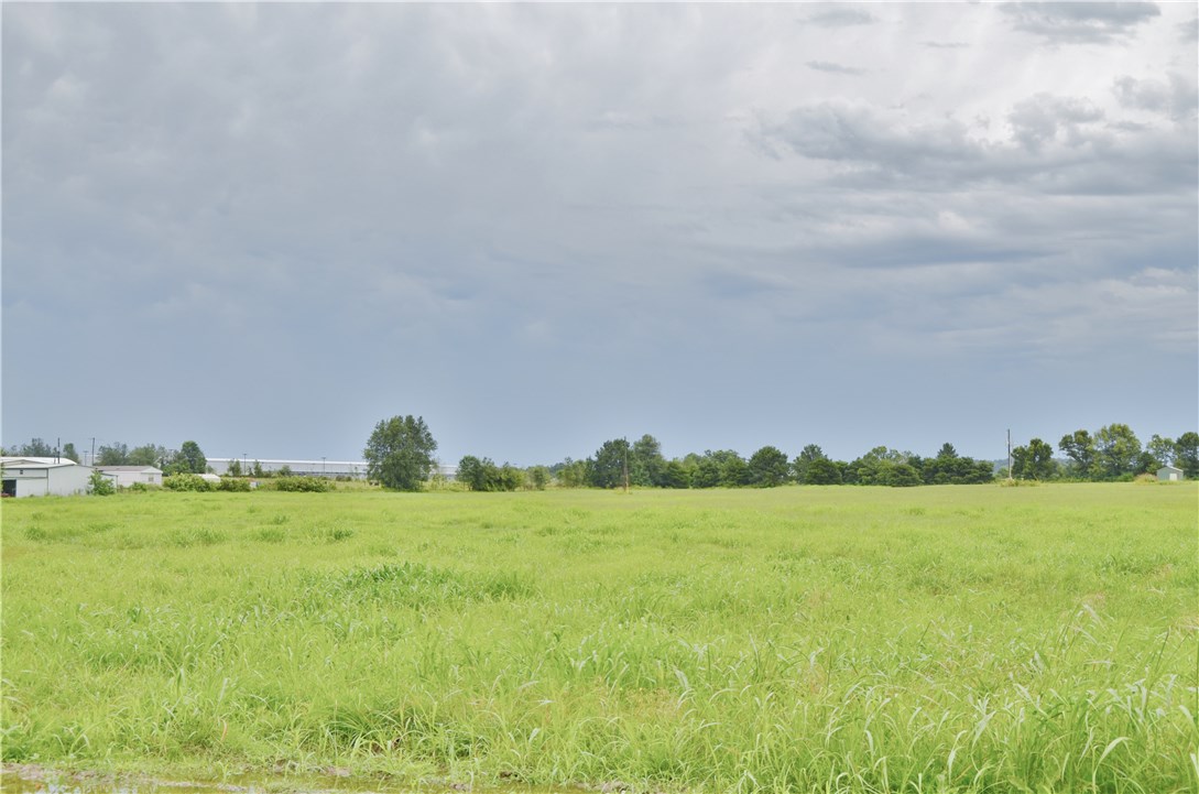 19.26 ac m/l of level beautiful land waiting to be developed in a great location that is growing. Razorback Greenway Trails across the street, close to I-49, shopping and restaurants.