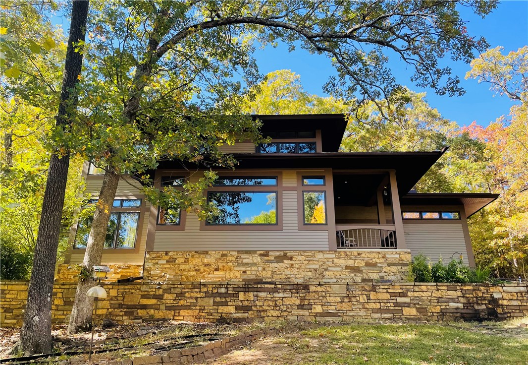 Nestled within the Sequoyah Preserve PUD in one of Fayetteville's most sought-after neighborhoods, this 3,068 sq ft home offers serene, wooded surroundings with greenspace adjoining the north and east sides of the property all just minutes from downtown, Dickson Street, and the University of Arkansas.
Built in 2000, this 4-bedroom, 2.75-bath home is loaded with quality and peace-of-mind features. Hardie fiber cement siding a fireproof composite material provides exceptional durability and protection. Premium Pella windows offer lasting energy efficiency and beautiful natural light. No basement? No problem, the crawl space offers as close to storm shelter protection as possible without being a designated storm shelter, giving you added confidence when Arkansas weather rolls in.
Enjoy neighborhood amenities through the HOA, nature at your doorstep, and the best of Fayetteville just around the corner.