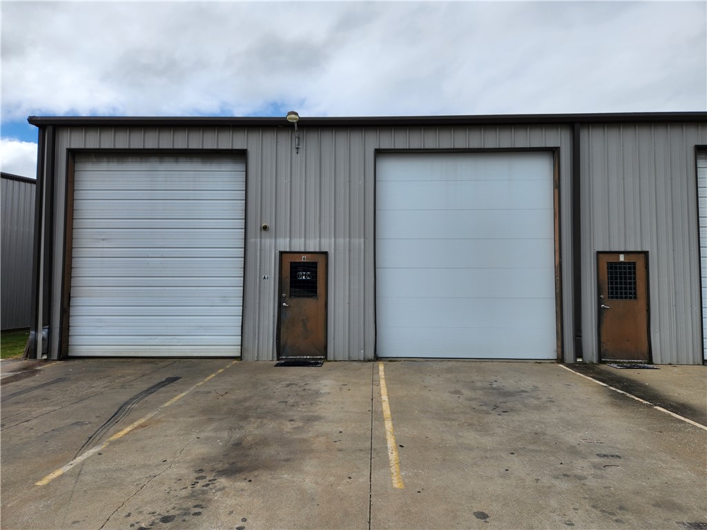 Ideal commercial warehouse space with overhead bay doors in prime Industrial Park close to Springdale Municipal Airport! This expansive 2,300 sq ft gem is now available for lease. Featuring two large overhead bay doors, these two combined warehouse units offer easy access for business operations. The high ceilings allow for vertical utilization of space, maximizing storage capacity, while the open floorplan allows for efficient layout design, ensuring optimal workflow. Gas heaters allow tenant to maintain a comfortable temperature year-round. (Tenant is responsible for utilities.) Built-in bathroom ensures convenient comfort. Lease opportunity requires a minimum 1-year commitment (longer terms negotiable), providing stability and long-term planning for tenant's business. Don't miss out on this prime location that offers ample space and versatility to suit a variety of commercial needs while providing visibility and easy access for clients, suppliers, and employees alike. Contact us to schedule & coordinate a tour!