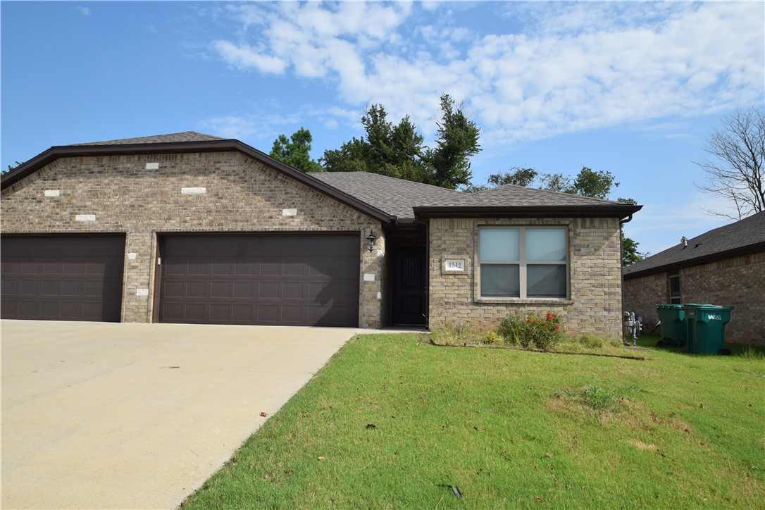 Newer duplex in great location! Close to the Wal-Mart neighborhood market on Hwy 102 and green house road in Bentonville. 3 bedroom split plan, 2 baths, open living space, wood look tile in main living space and carpet in the bedrooms. Kitchen has gas range, granite, & pantry. Home has refrigerator, washer & dryer. No smoking.  Lawn care included.