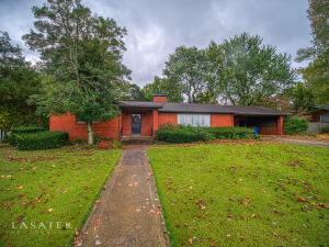 One-of-a-kind stunning Ranch-style brick home on a tree-lined street, blocks from downtown.  Custom built in an established neighborhood.  Spacious living room/dining room and separate spacious family room.  The tree shaded backyard and brick patio make for outdoor or indoor entertaining or privacy for your morning coffee.  4 bds/3.5 baths includes TWO primary bedroom suites.  Plenty of storage through the home.  It has a storm shelter.